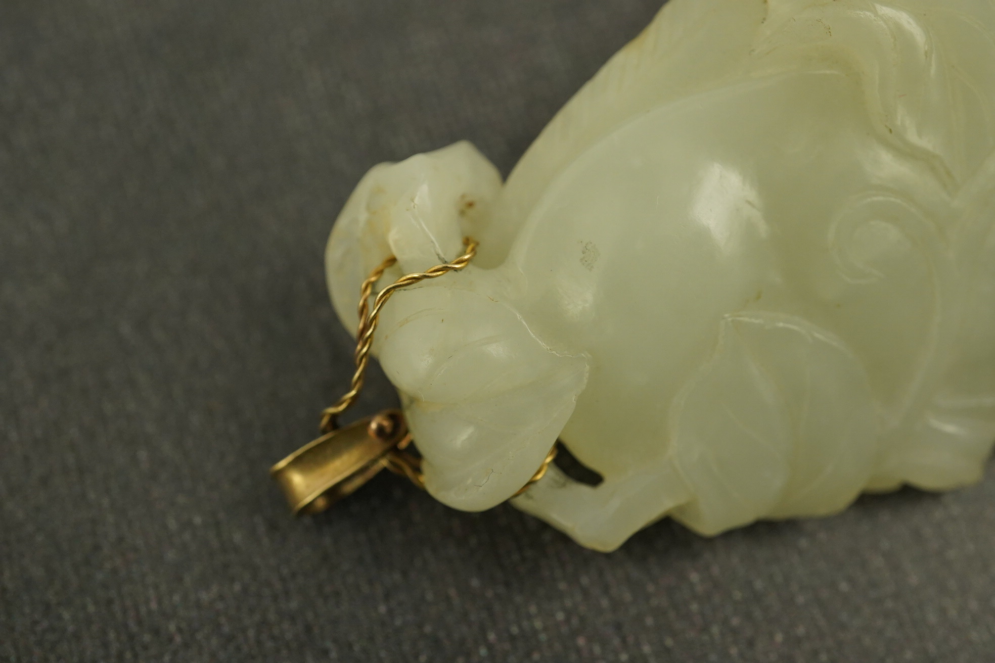 A Chinese pale celadon jade twin gourd pendant, 18th century